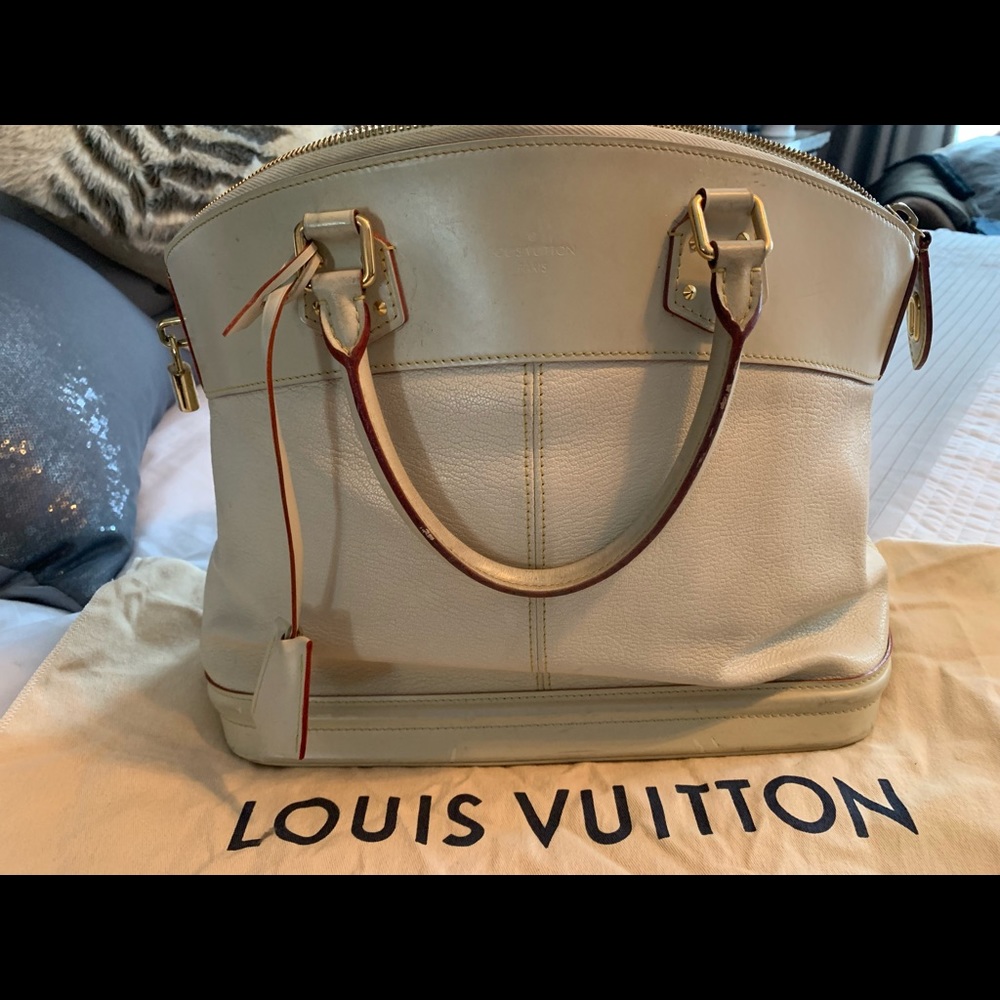 Louis Vuitton Cream Suhali Leather Lockit GM bag.